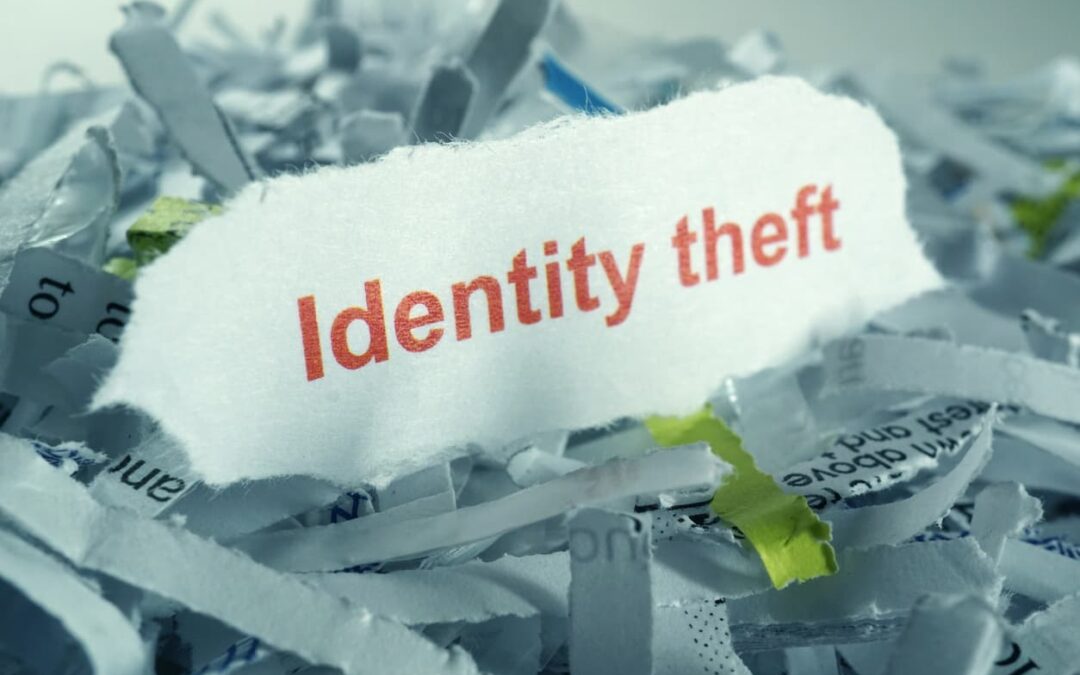 identity theft written on top of shredded paper