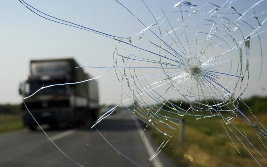 Cracked windshield on overlooking highway