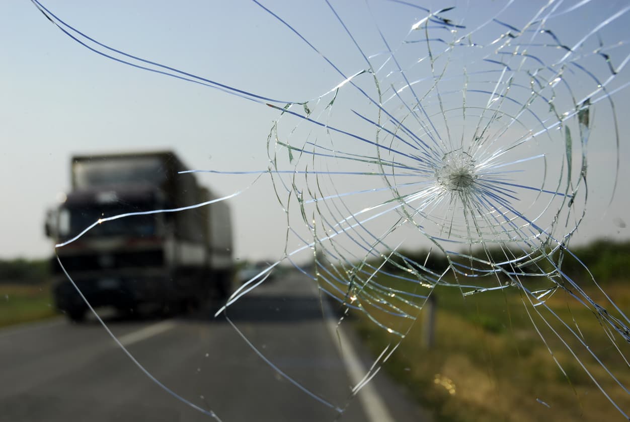Cracked windshield on overlooking highway