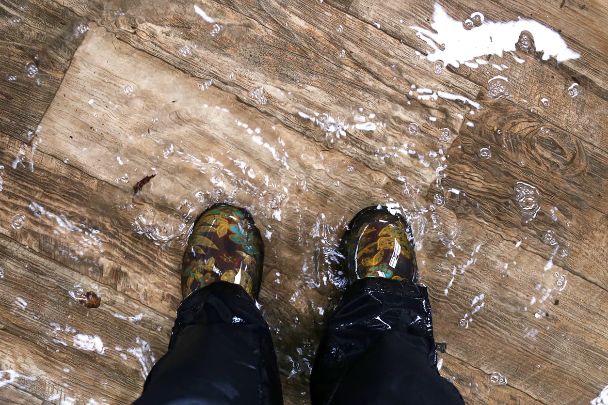 feet standing in a flooded house