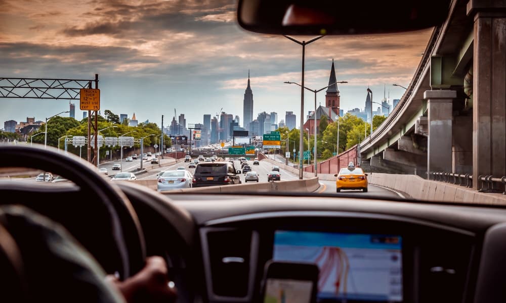 View from a driver’s window of the Empire State Building and the Manhattan skyline