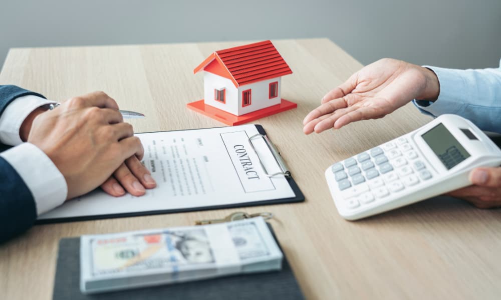Real estate broker agent consulting with customer to sign insurance form agreement